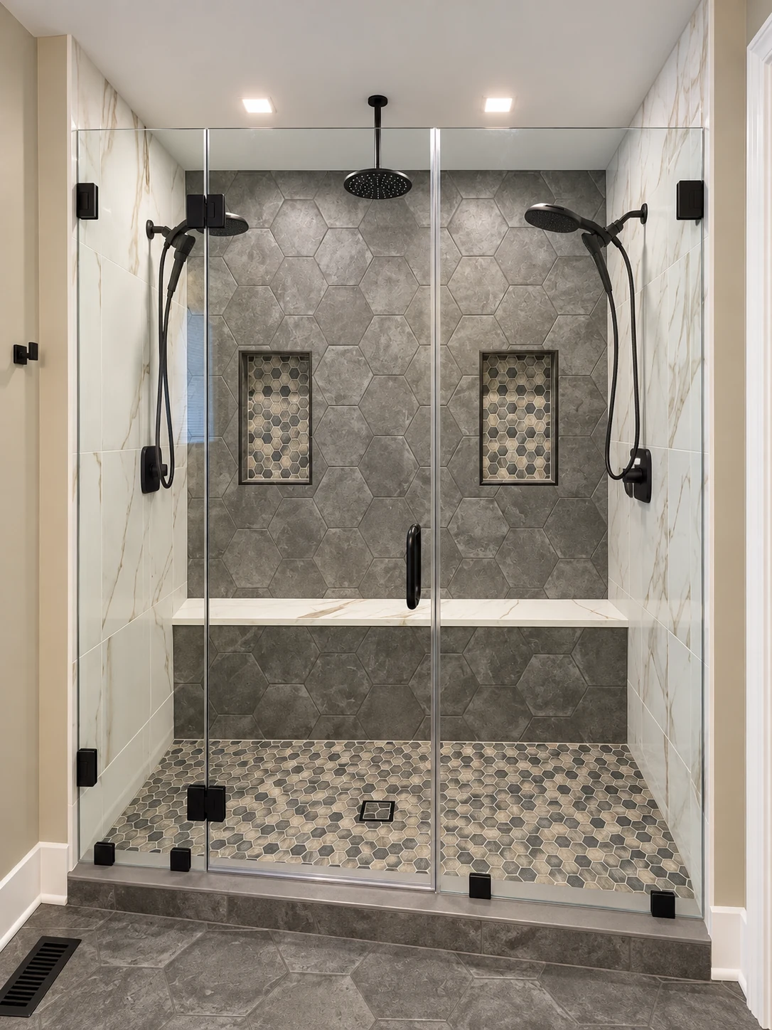 Glass shower with bench, niches and hexagonal tile